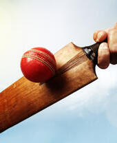 An antique cricket ball and bat