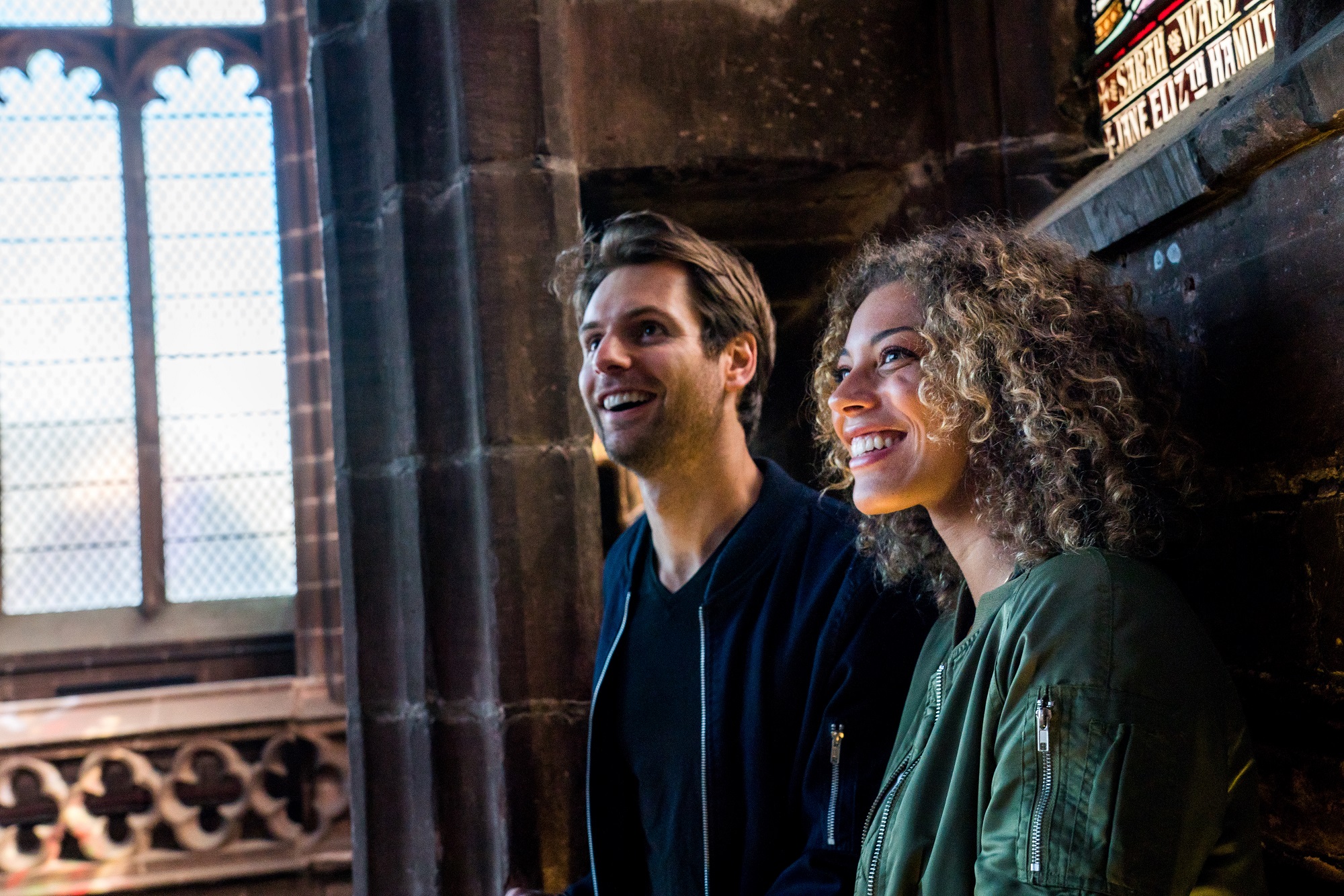Two people touring Chester Cathedral