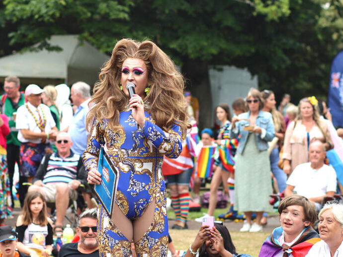 A person in a drag outfit at Exmouth Pride