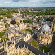 Aerial view of university featuring large dome and historic stone buildings