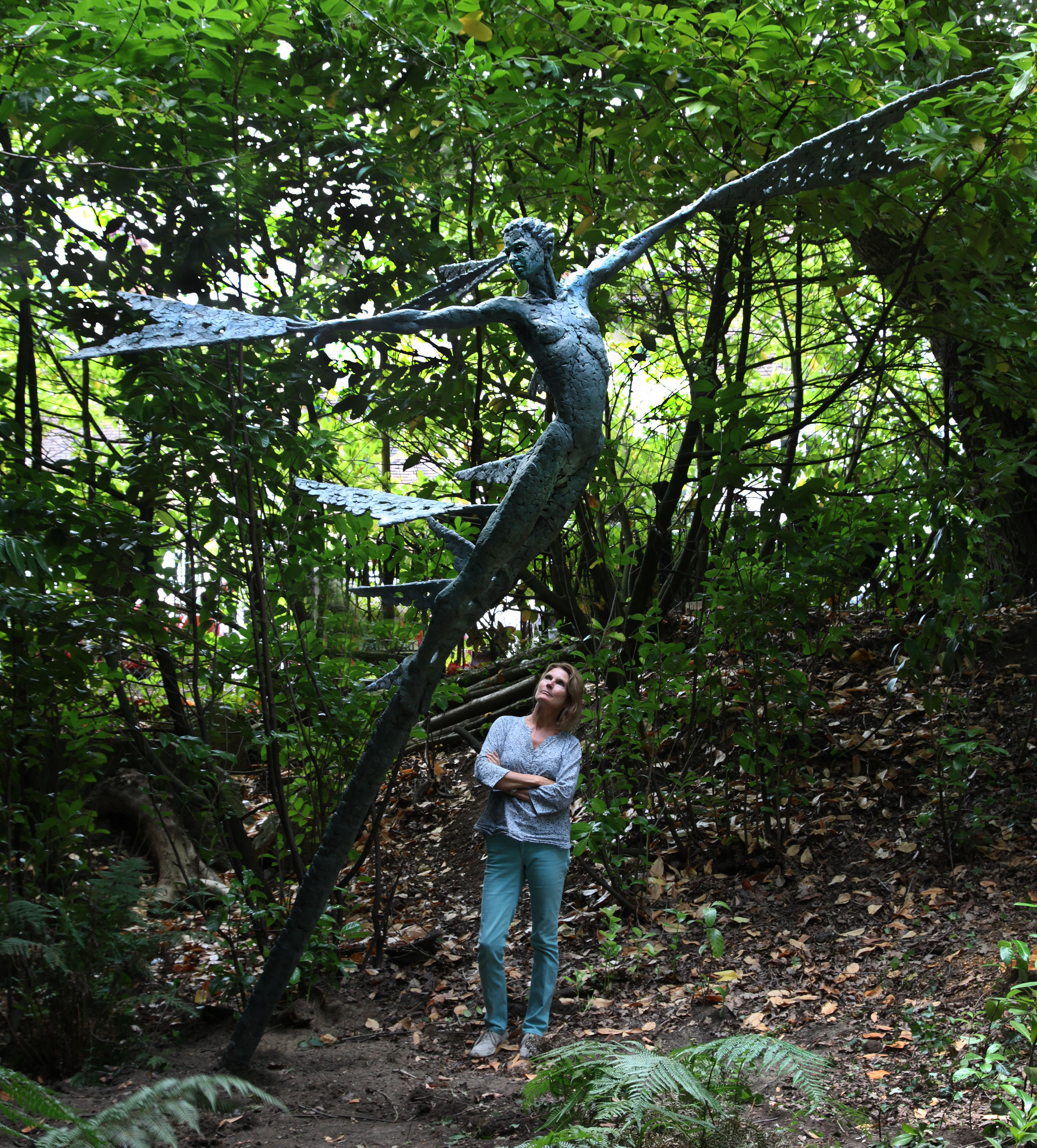 Artist with sculpture Theia Goddess of light at The Sculpture Park