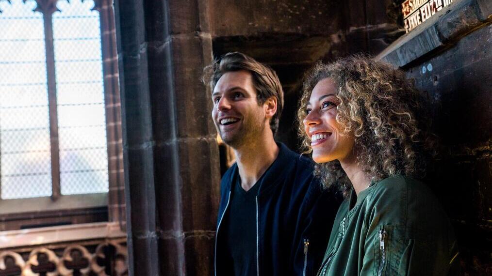 Two people touring Chester Cathedral