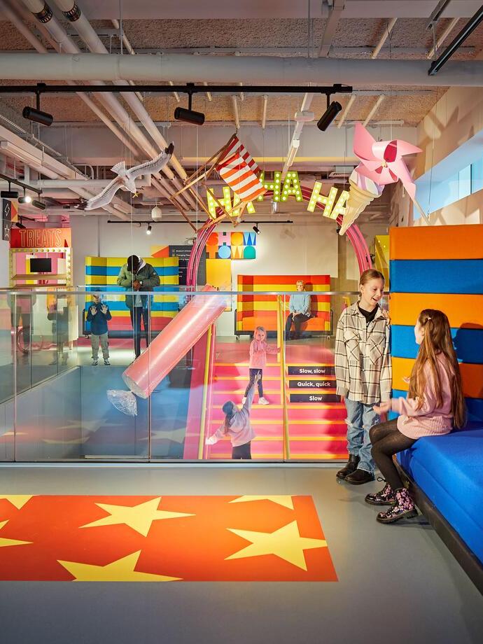 Children playing in a colourful play area