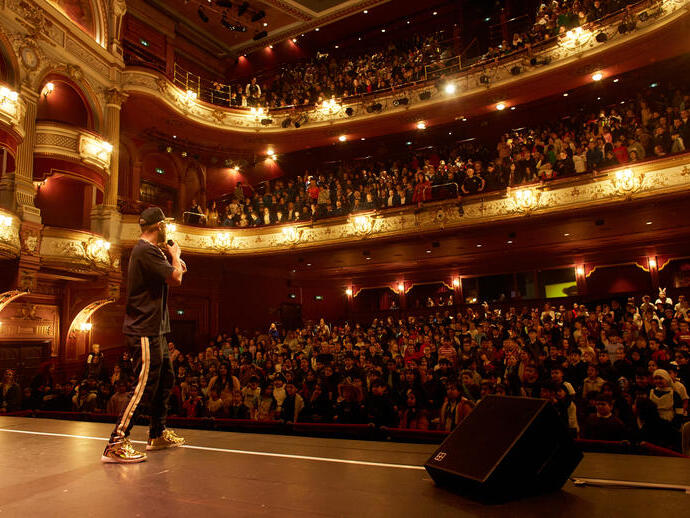 A performer on stage at Bradford Literature Festival