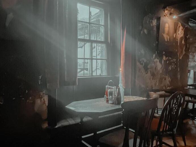 Atmospheric view inside old Drovers Inn Hotel dining area