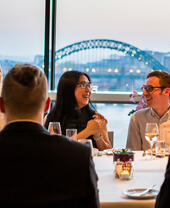 A group of people enjoying dinner at Six Restaurant in Newcastle upon Tyne