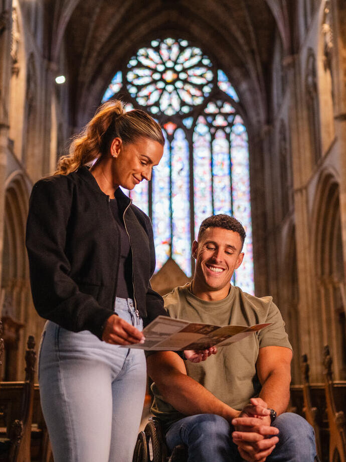 A man and a woman visiting Worcester Cathedral 