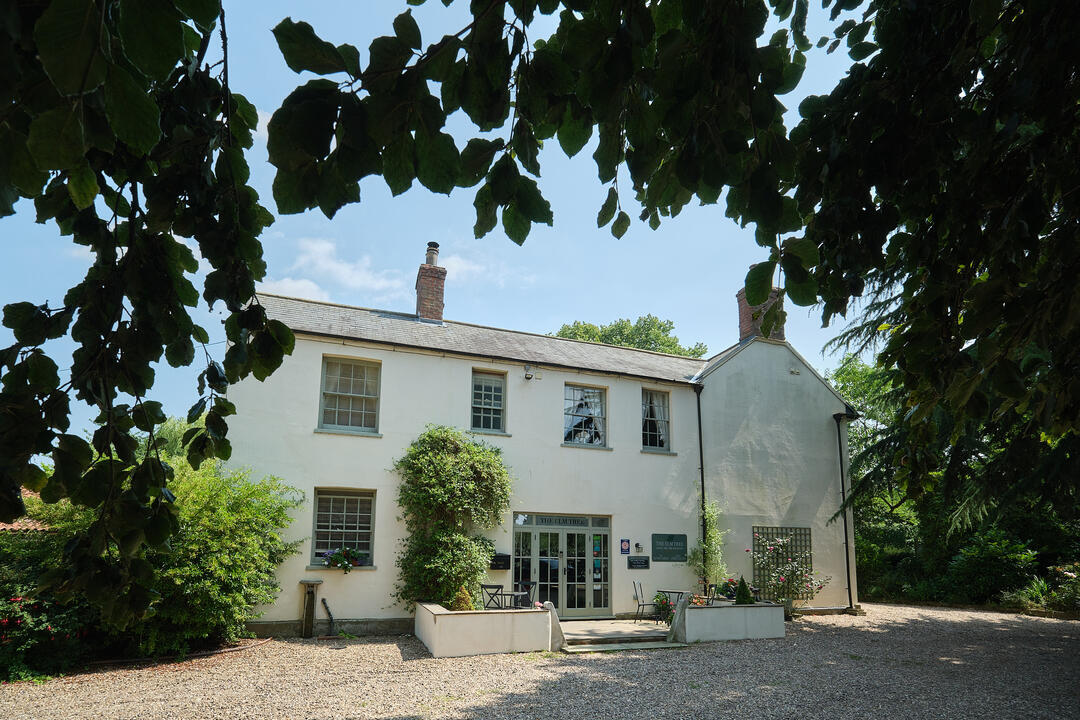 An exterior shot of Elm Tree B&B in the sunshine