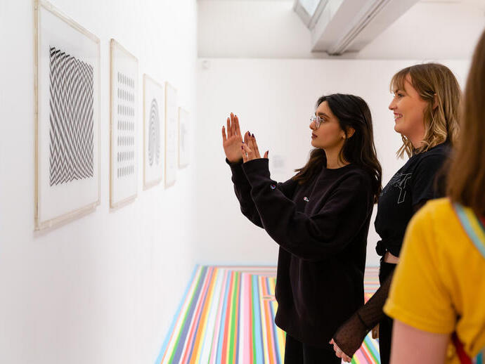 Young people discussing Bridget Riley at the Tate Liverpool