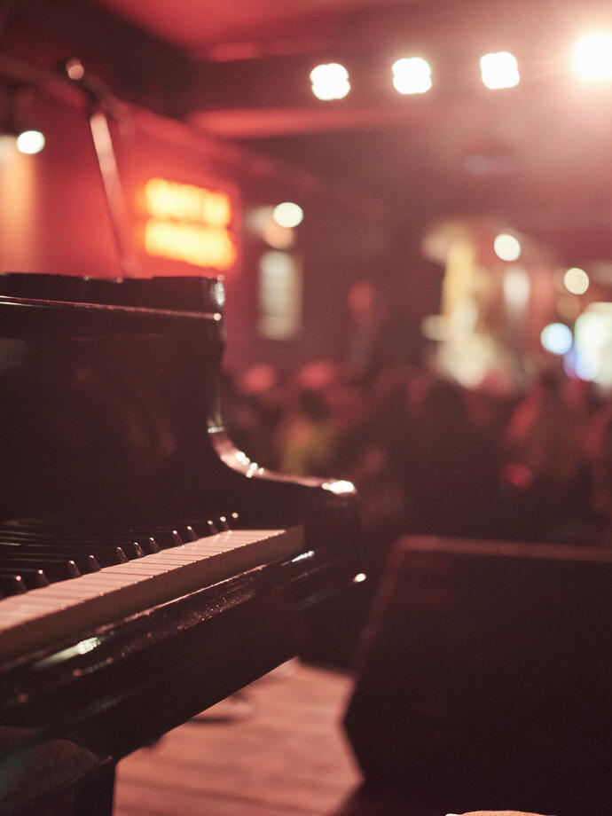 Piano on a stage in a bar