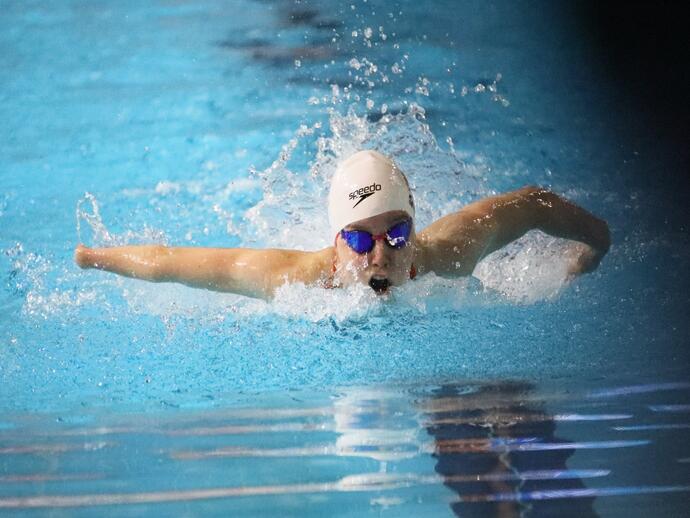 Close up of woman swimming in a swimming pool