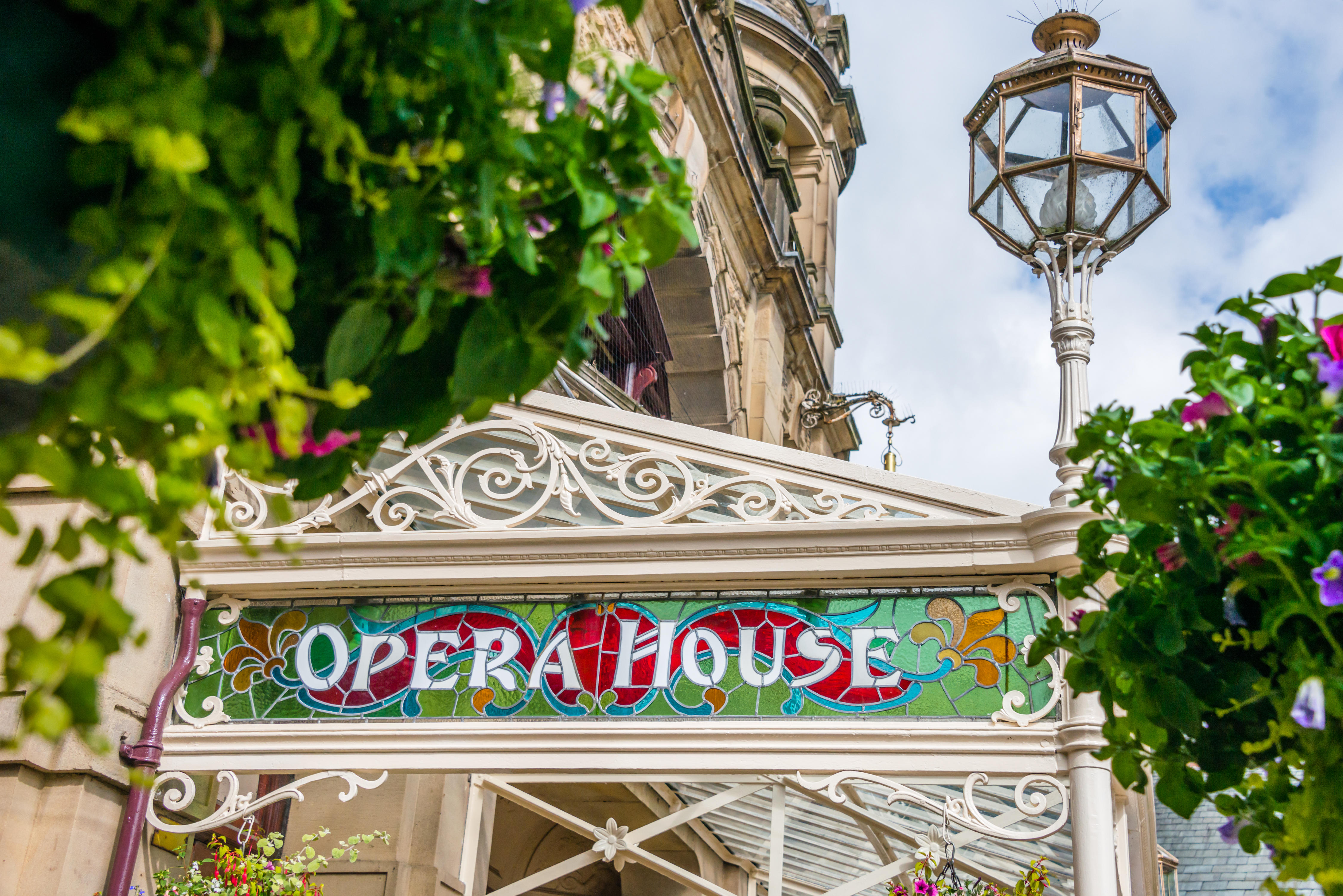 The stained glass signage on the front of Buxton Opera House, Derbyshire, UK