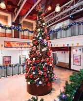 A theatre stage mock up of Paddington Station at Christmas.