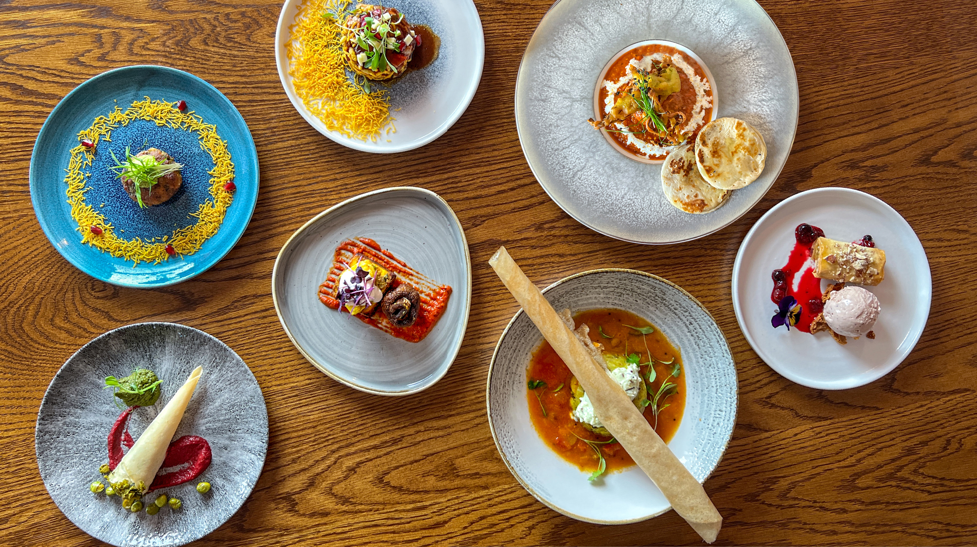 Various dishes served on a table at Prashad Restaurant in Leeds