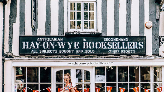 Woman walking past a bookshop