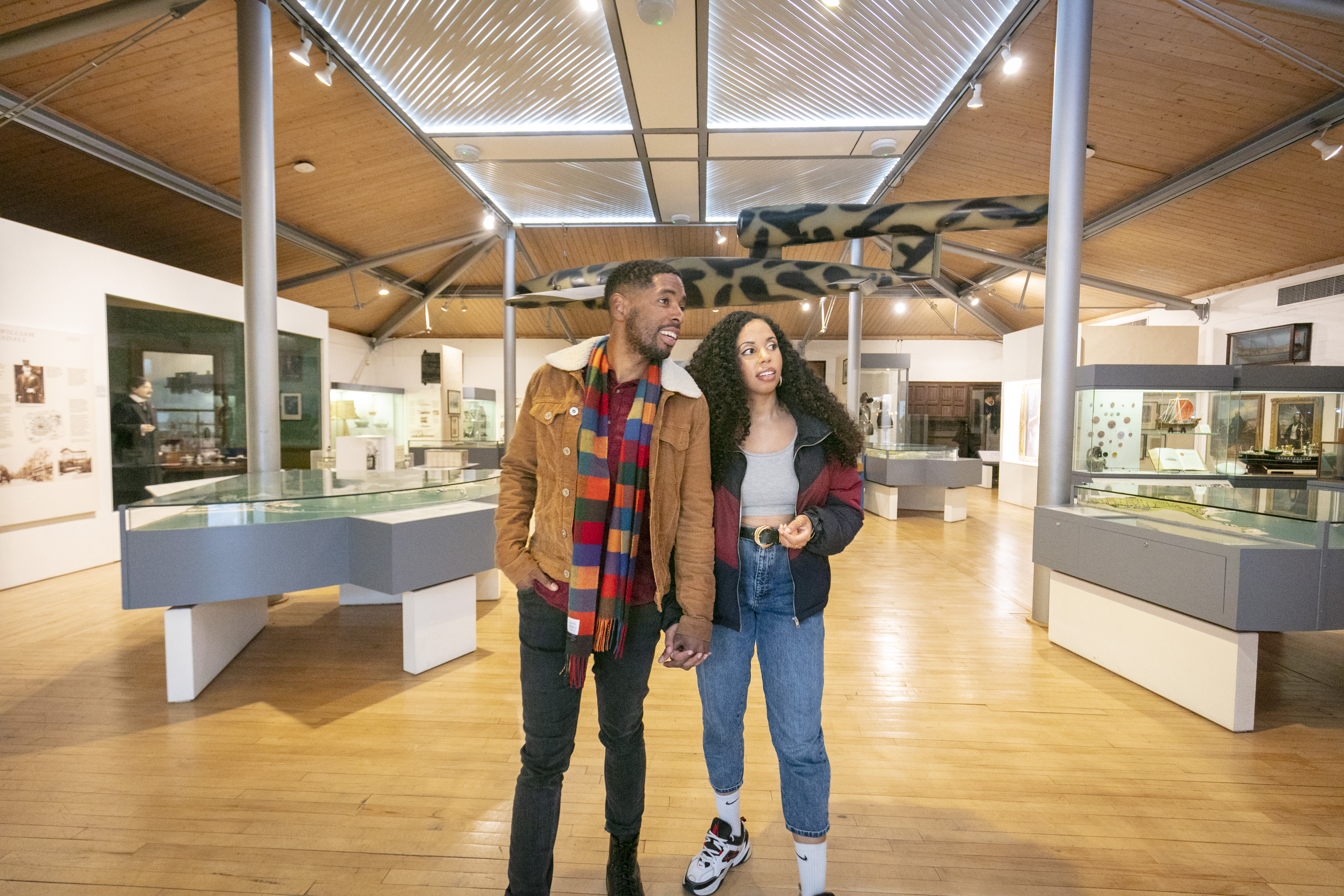 A man and woman look at exhibits at Dover Museum