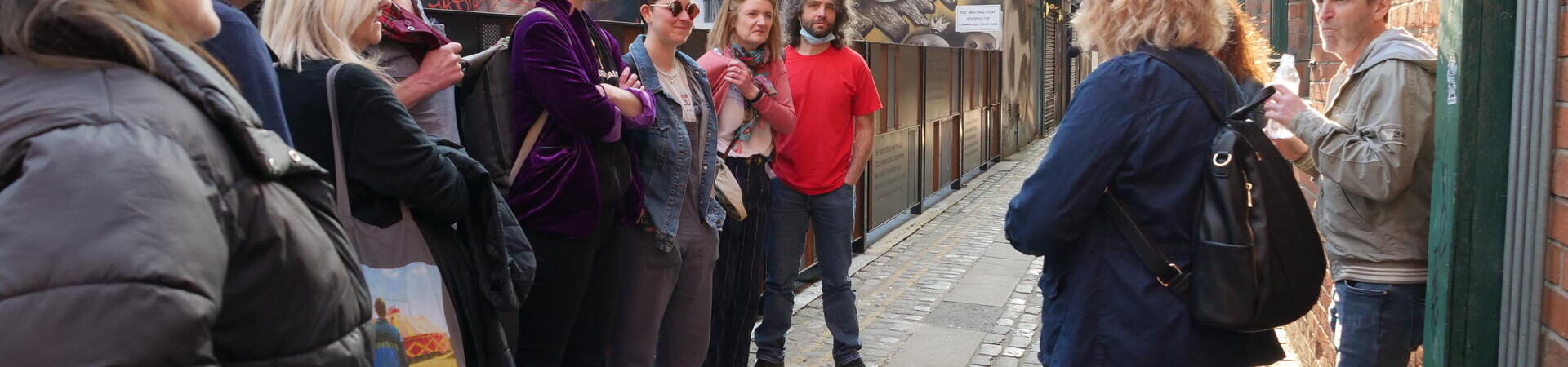 Group of people on street taking part in Belfast Music Tours