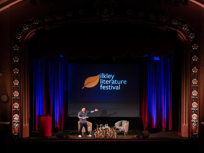 Presenter on stage at the Ilkey Literature Festival