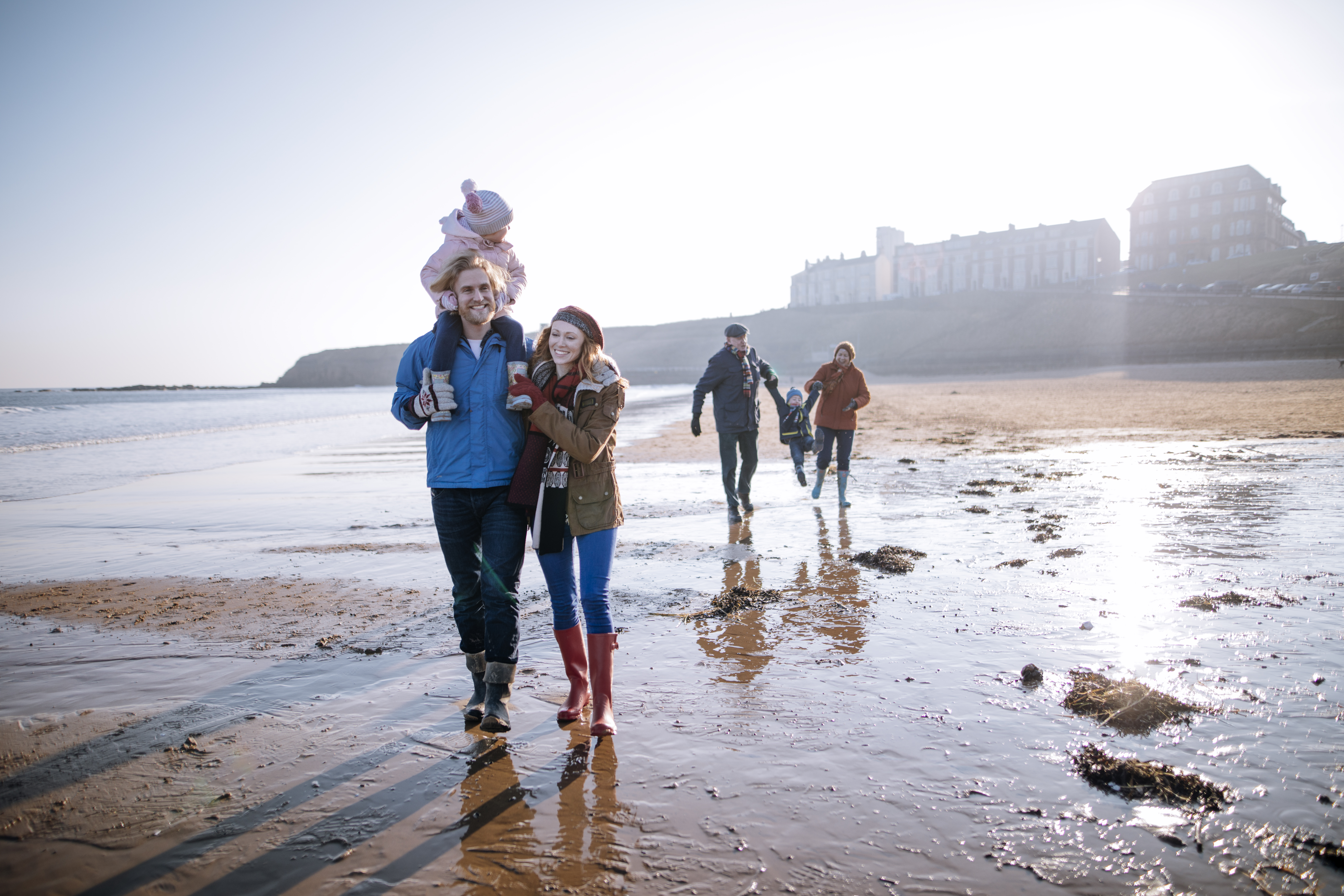 Family walking on the beach