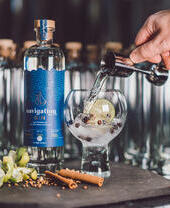 Bottle of gin and some glasses at Dyfi Distillery