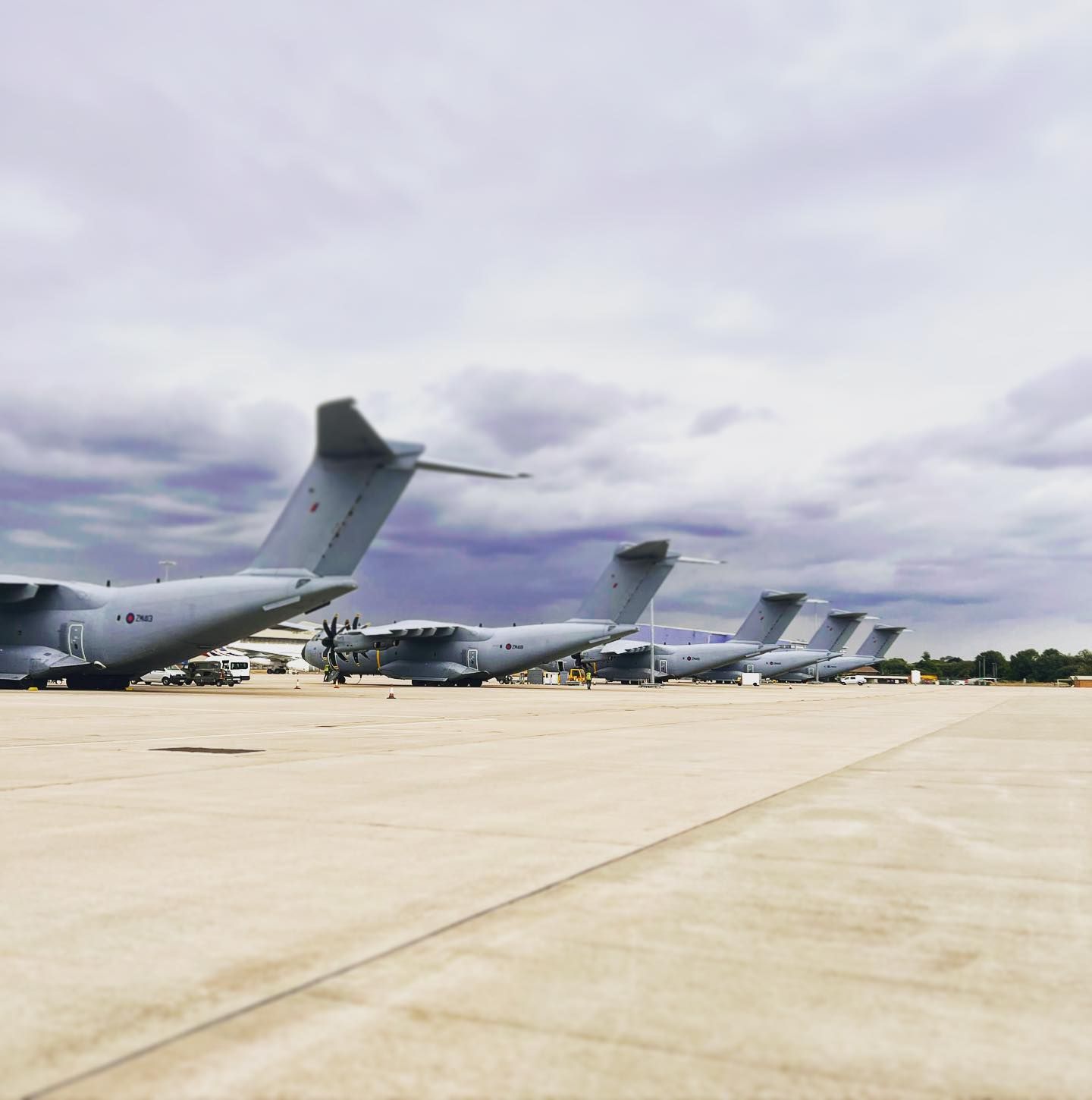 A row of military style aircraft on display at Brize Norton airfield in Oxfordshire
