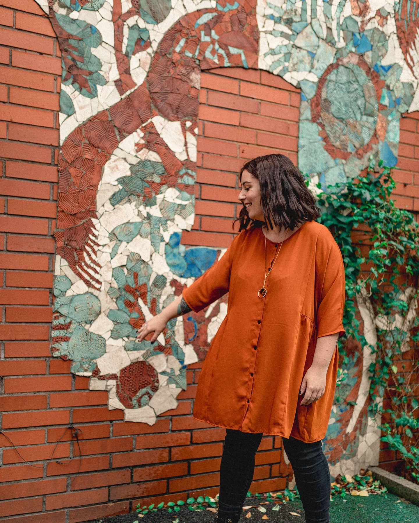 Standing infront of a mural