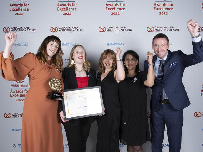 Photo of Gold Winners for Resilience and Innovation Award - Black Country Living Museum - in front of the branded photo backdrop
