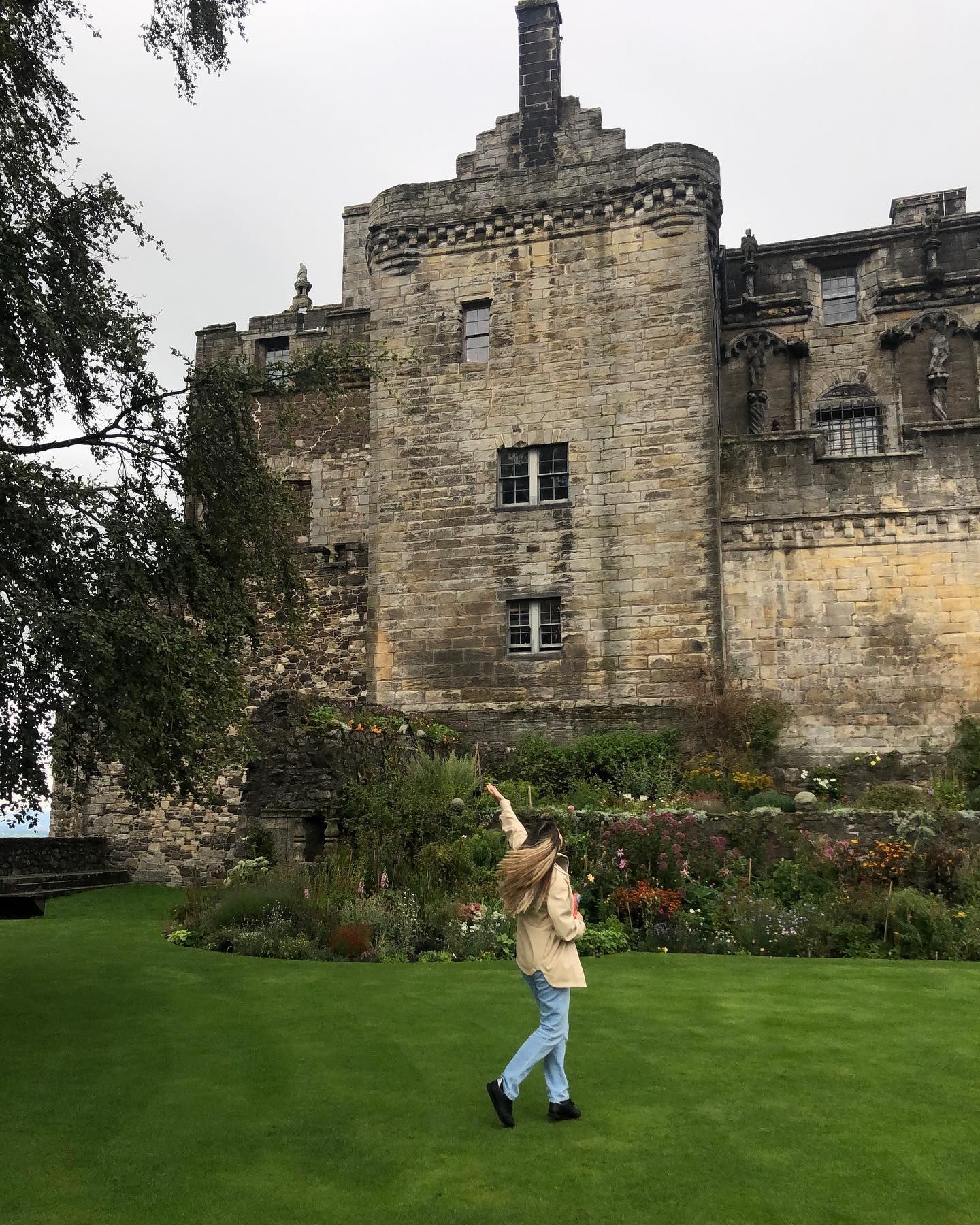 A woman posing in front of Stirling Castle, Scotland