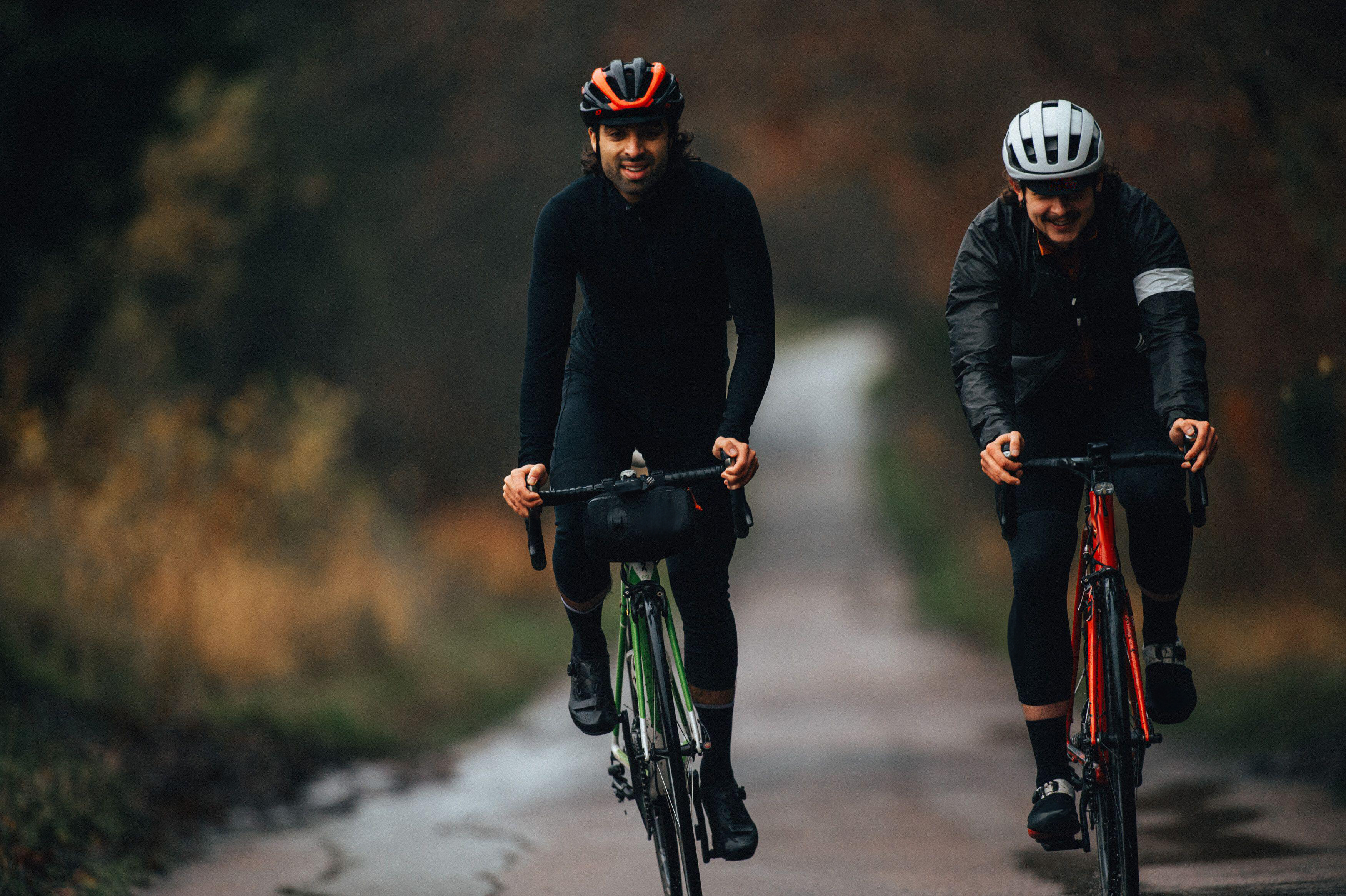 Two cyclists riding on a road