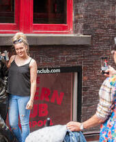 A woman posing outside the Cavern Club in Liverpool, a famous venue in the history of the Beatles