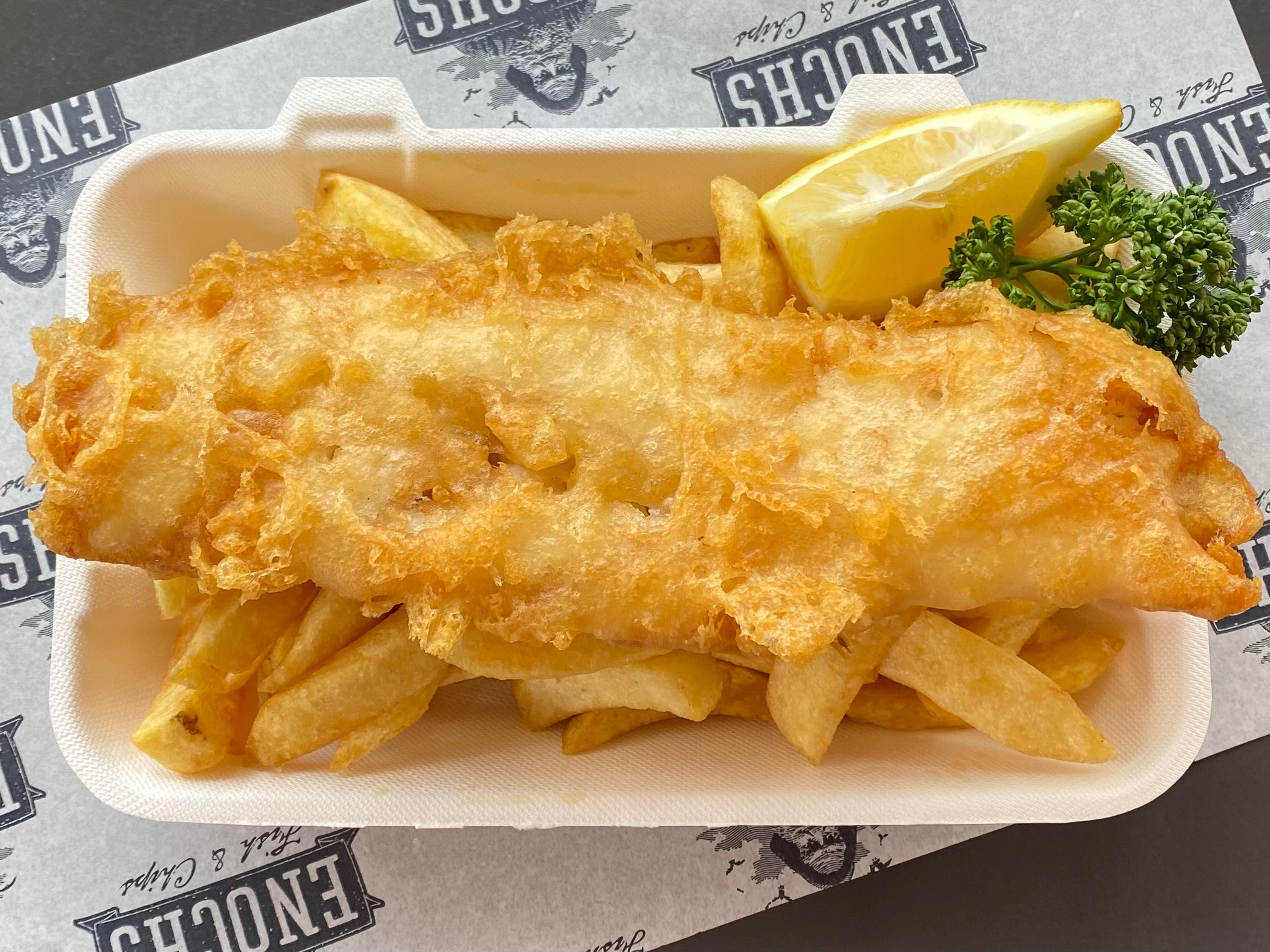Fish and chips being served at Enochs Fish & Chips in Snowdonia/Eryri National Park