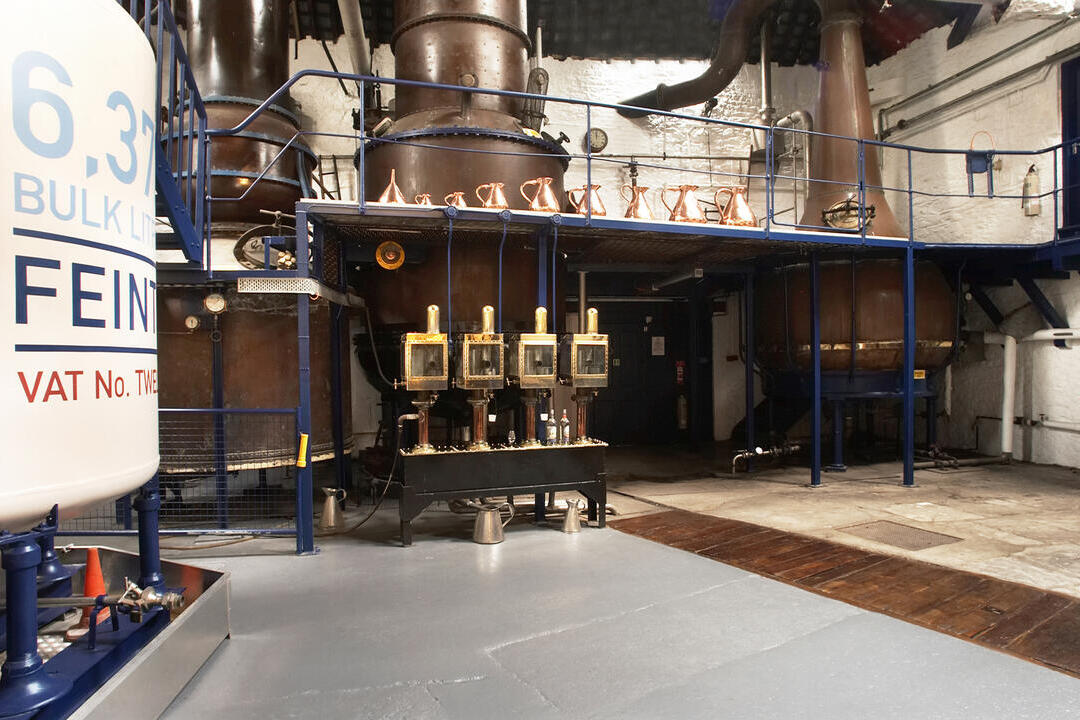 Distillery machines lining the wall at Plymouth Gin