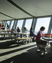 Walkers dining in a café situated high on a mountain