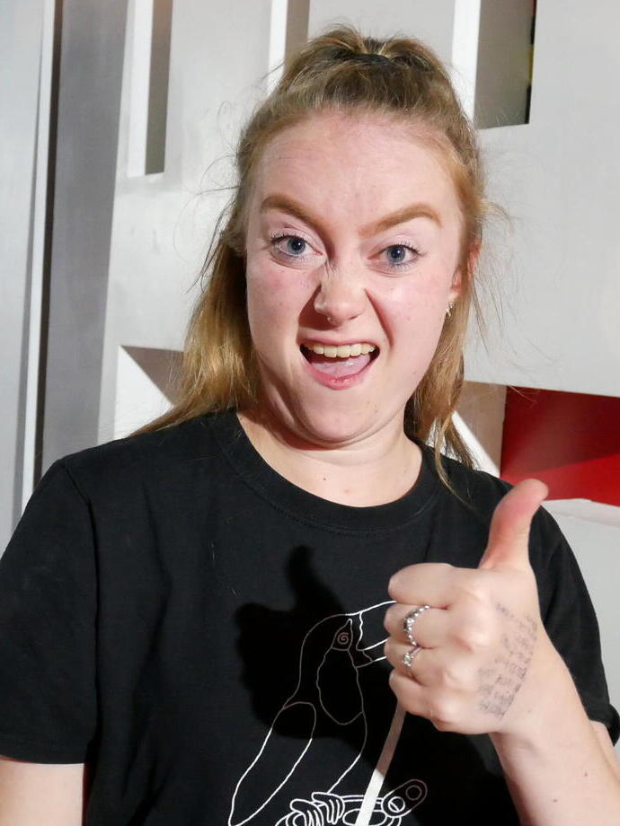 A lady with her thumbs up at Birmingham Comedy Festival (autumn)