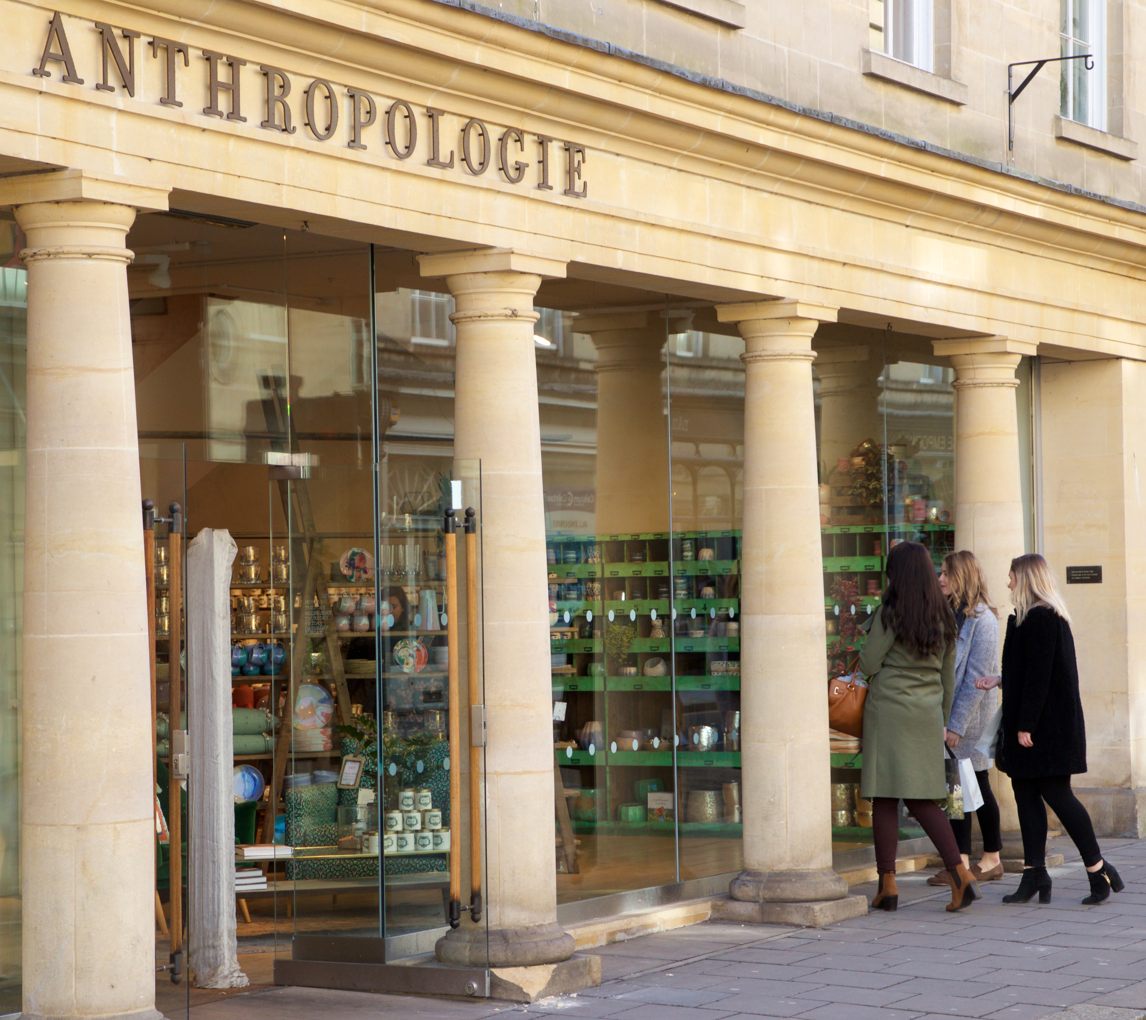 A group of women entering a shop in Bath