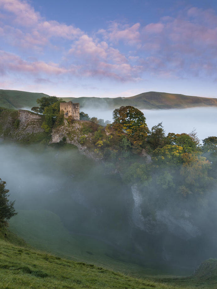 Castle on a beautiful misty morning in Autumn