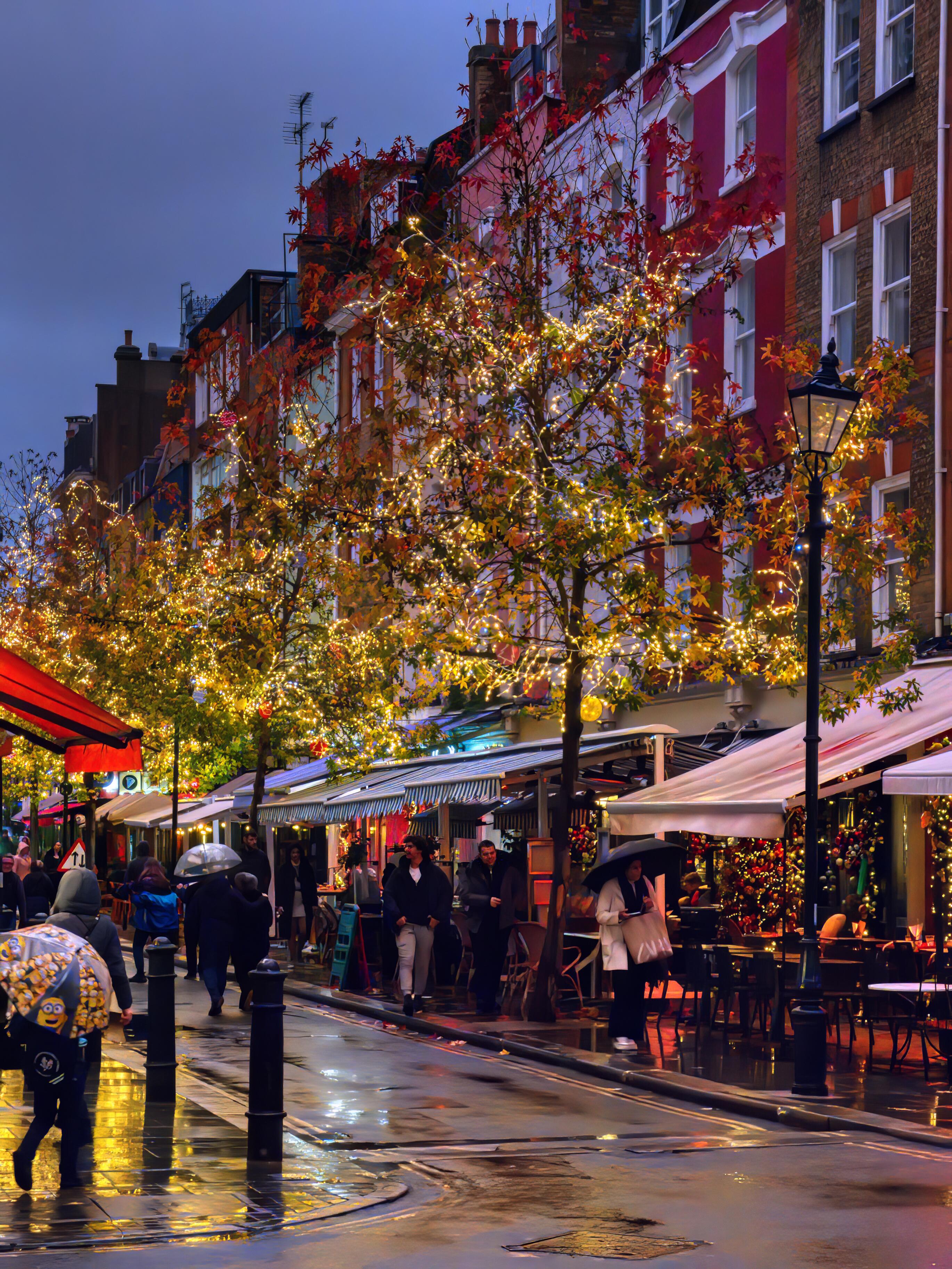 A nighttime shot of St Christopher's Place on Oxford Street, complete with market stalls