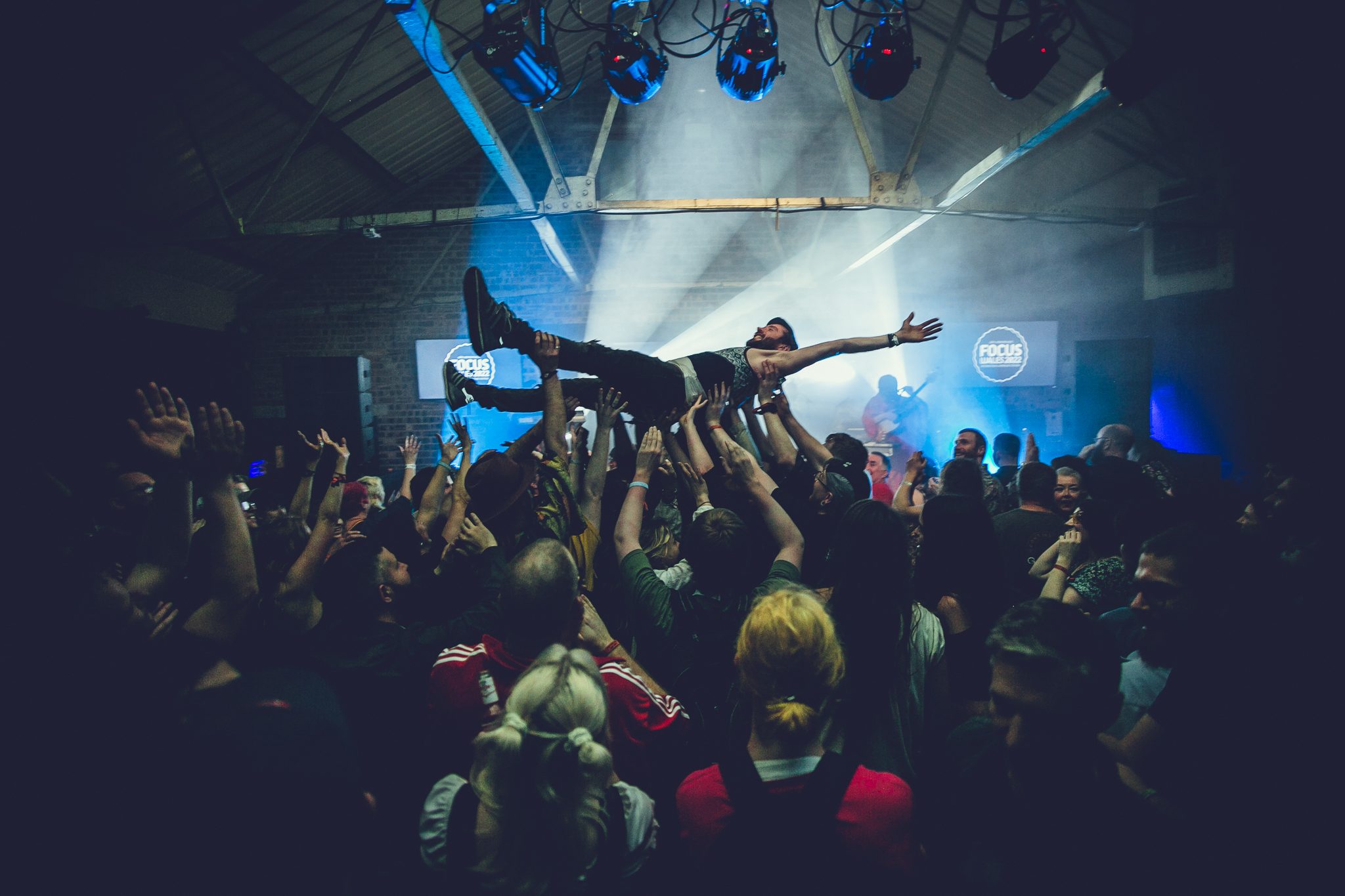 People at concert, man crowd diving