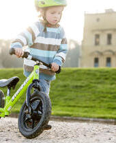 A child riding a bike outside Ashton Court in Bristol