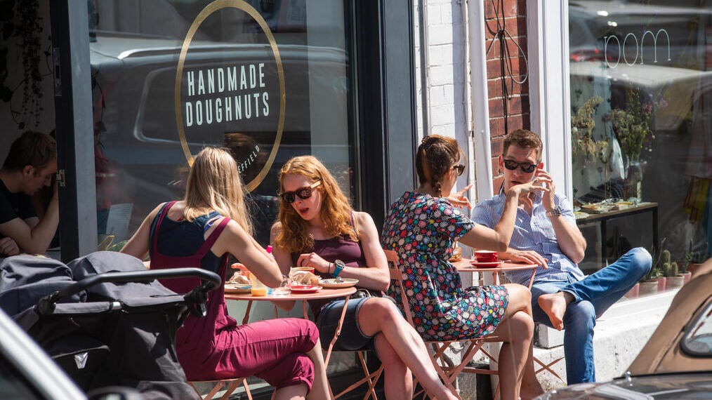 Groups of people sitting outside Handmade Doughnuts in Sheffield