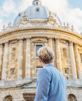 Man looking up at an historical building