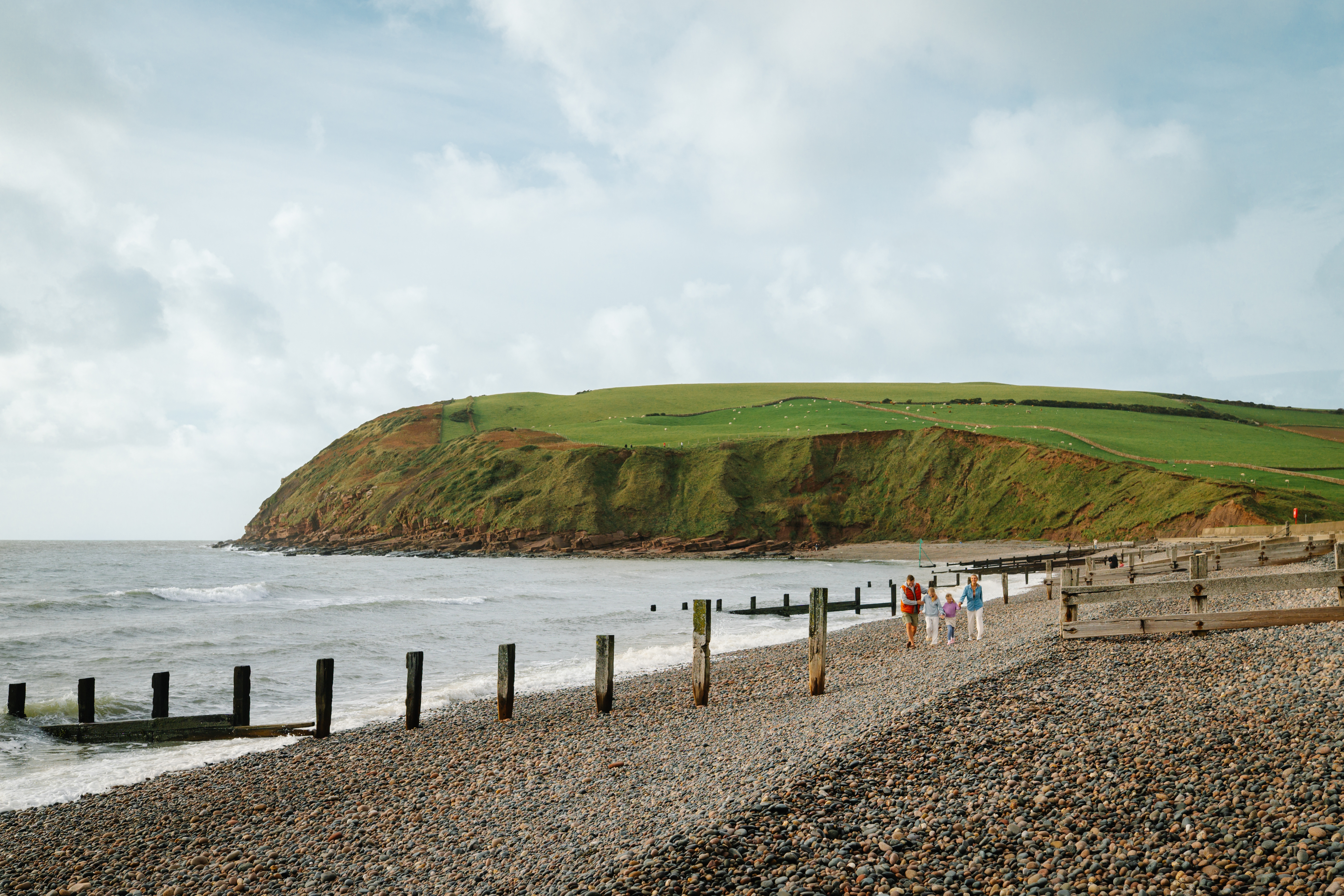 Family walking along a beach