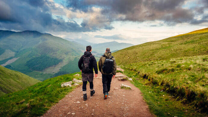 Two men hiking on Ben Nevis in the summertime