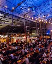A high view of people eating a drinking at tables at Dockyard Social, Glasgow