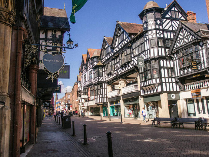 City high street with historic buildings and shops