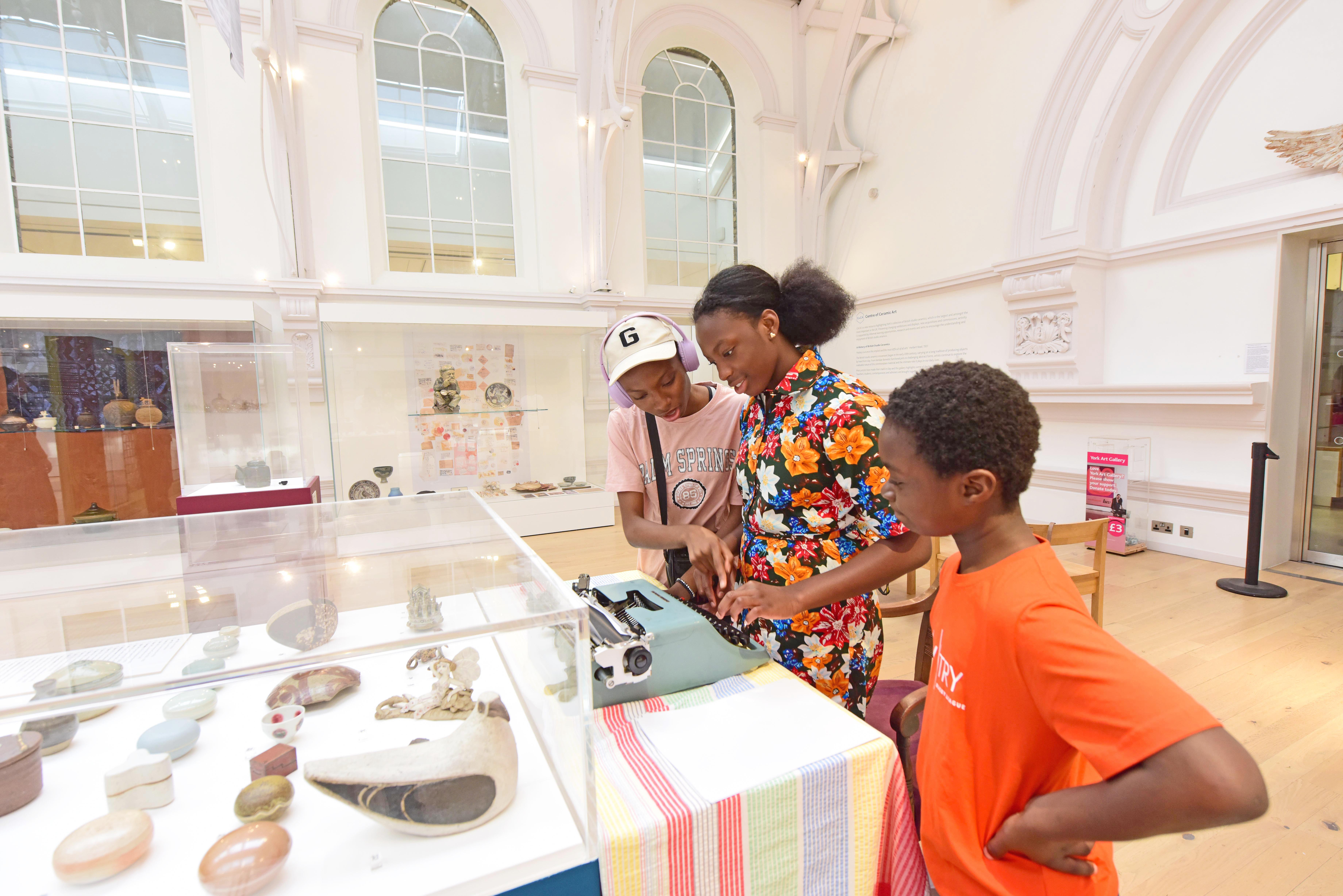 A family looking at an exhibit in York Art Gallery