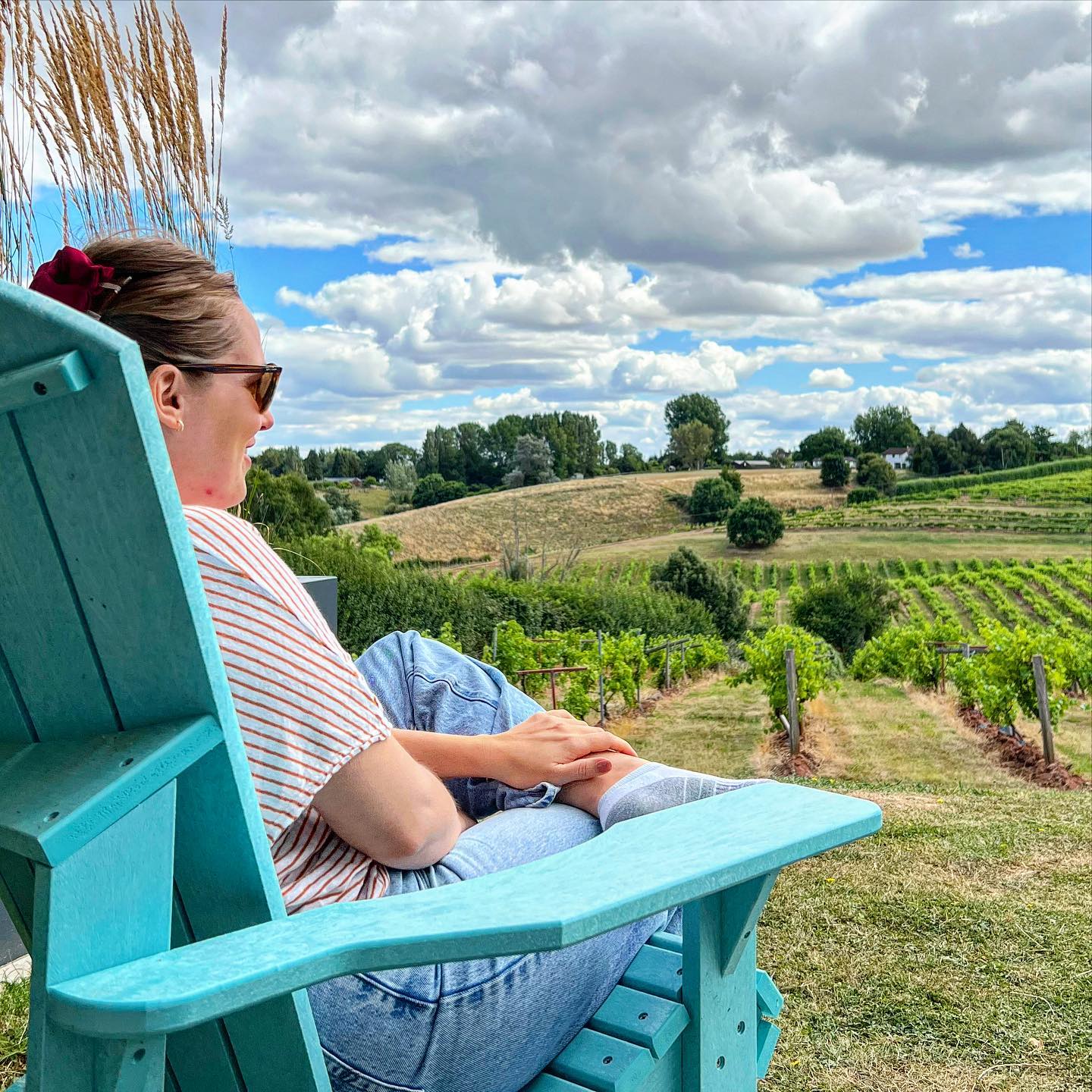 A lady sitting down at Three Choirs Vineyard