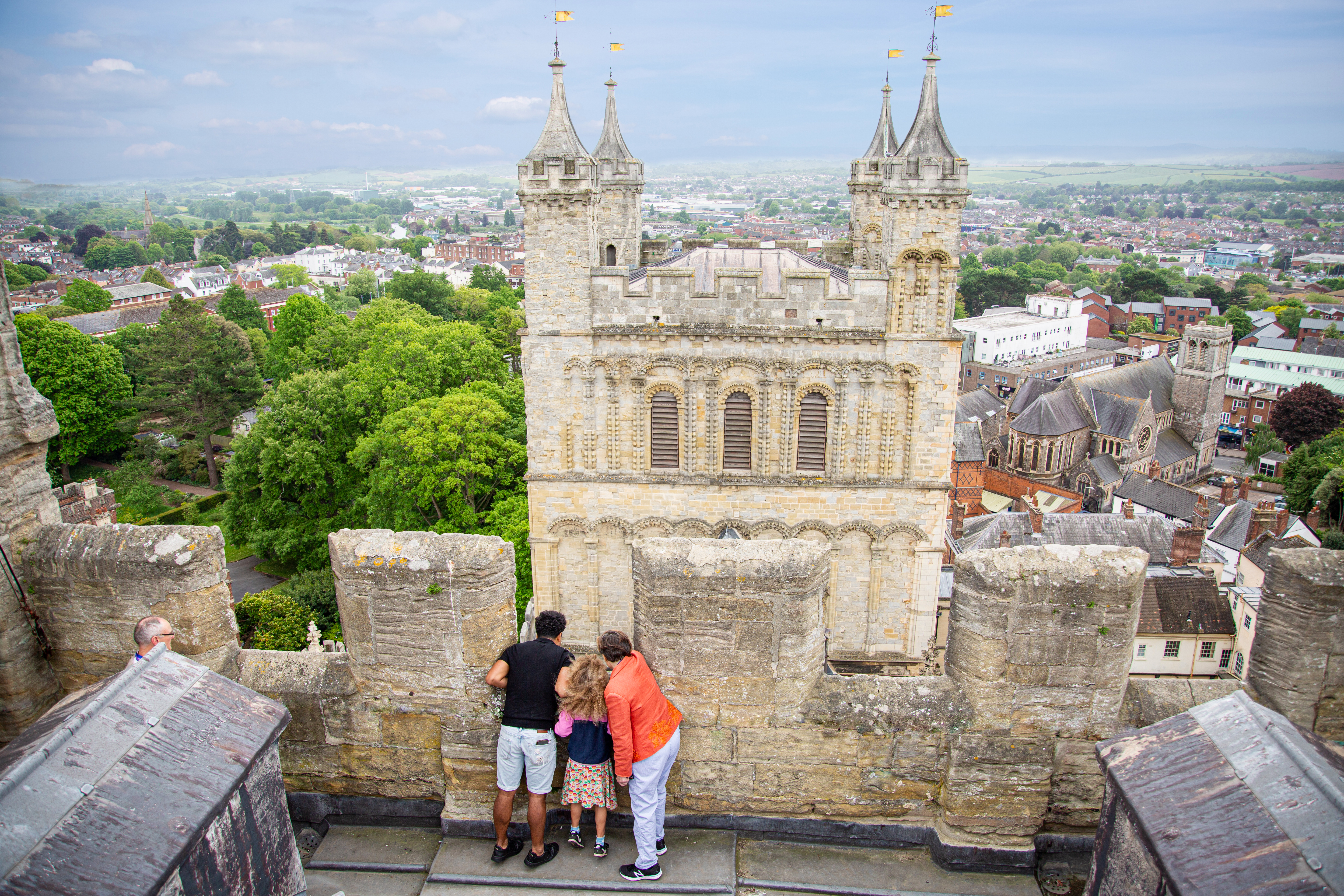 Aerial view of people looking down from a tower at Exeter Cathedral