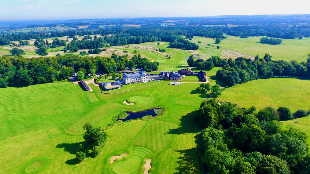 An aerial photo of a large hotel and golf course