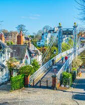View of residential houses alongside a bridge over a river